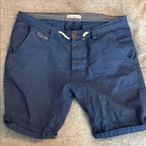 Navy Blue slim fit shorts. Hits just above knee.